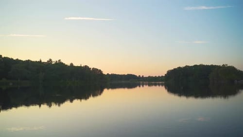 Calm scenic river during a sunset on a quiet peaceful evening