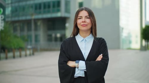 Portrait of a Woman in Office Clothes Against the Background of Business Center