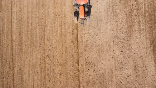 Tractor with Seeder in the Field