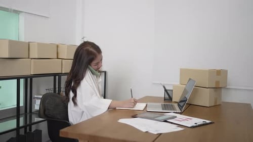 Young Adult Working in Ecommerce Business Office