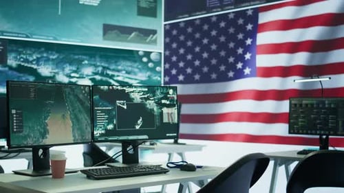 Data Office With Computer Monitors and American Flag
