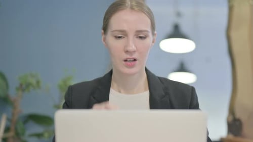 Close Up of Businesswoman having Headache while Working on Laptop