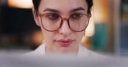 Portrait of Businesswoman Working on Laptop in Evening