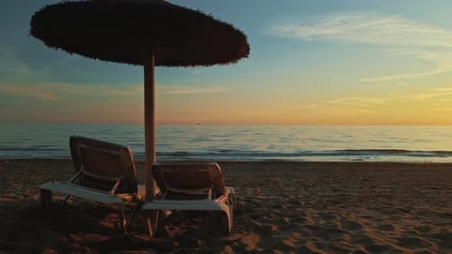 Empty parasol and chairs at the beach