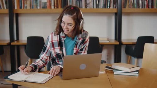 Young Girl College Student Sit at Desk Use Pc Laptop Computer Watching Distance Online Learning