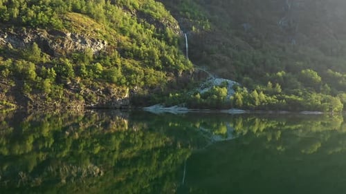 beautiful reflection shot of a waterfall in Norway