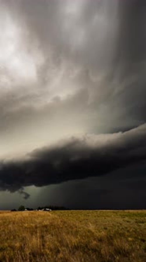 Dramatic Storm Clouds over Golden Field Landscape
