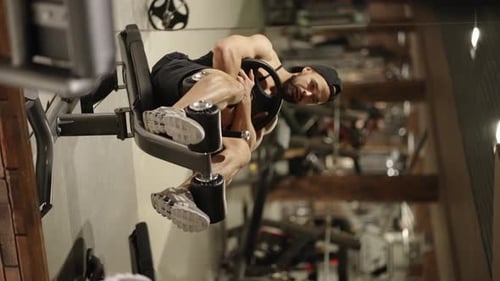 A Man Pumping Abs in the Gym