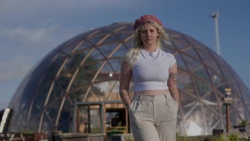 Woman Standing in Front of Geodesic Dome