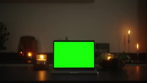 Stunning Video Footage Green Screen Laptop in a Candlelit Dark Room