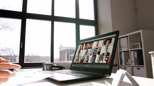 Virtual Meeting with Diverse Group on Laptop Screen