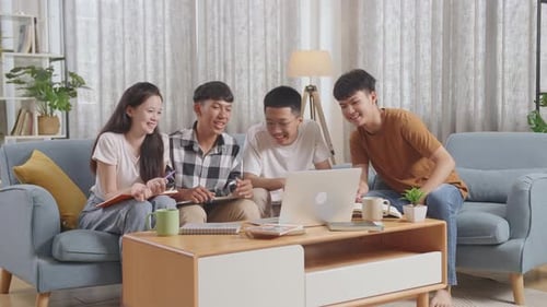 Friends Gather Around Laptop for Online Meeting