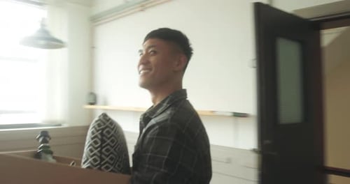 Man Moves Into New Apartment with Cardboard Box
