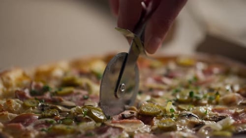 Pizza Slicing Close Up in Cardboard Box