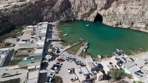 Drone aerial view of the Dwejra Inland Sea in Gozo, Malta, cinematic 60FPS footage showcasing