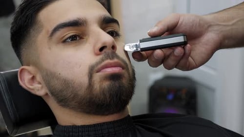 Man Getting Beard Trim at the Barber Shop