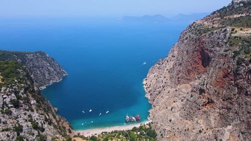 Beautiful view of the beach with boats, pure nature, sea and ships. Shot from a drone.