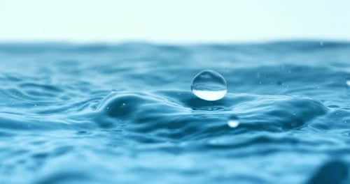 Rain water drops falling in super slow motion.