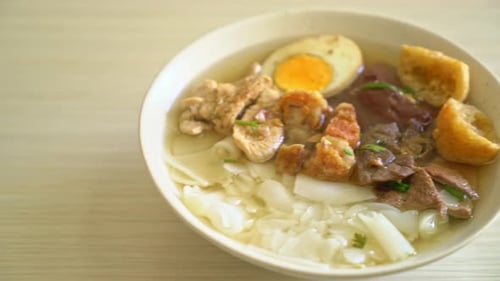 paste of rice flour or boiled Chinese pasta square with pork in clear soup
