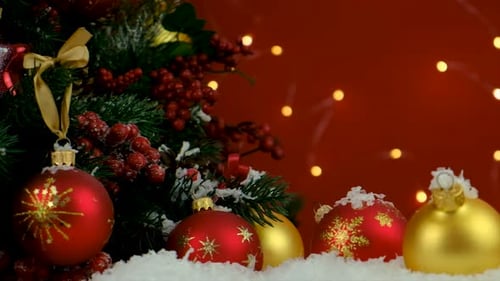 Christmas Ornaments in Snow with Twinkling Lights