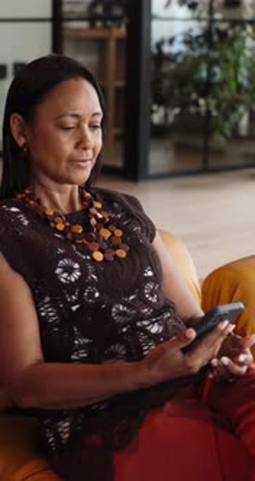 Funny, typing and woman in lounge, smartphone for communication and app for social media