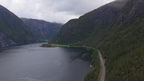 Aerial landscape of Norwegian fjord with coastal mountain road