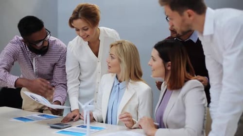 Professionals Working Together at Meeting About Green Energy