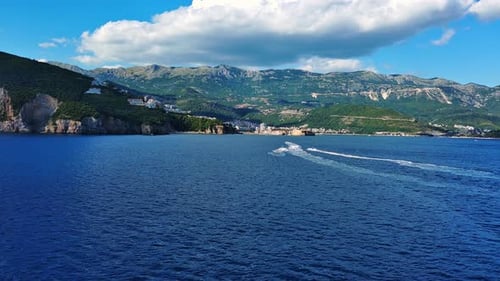 Motor Boats Float on the Sea Surface Creating a Pattern Against the Background of Clear Sky