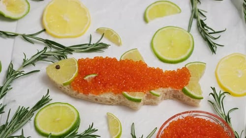 Fish-Shaped Sandwich with Salmon Roe and Citrus Garnish
