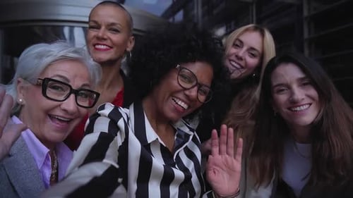 Diverse Group of Women Smiling and Waving