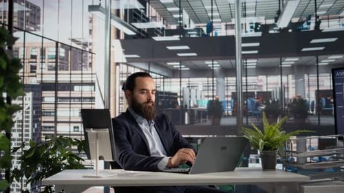 Portrait Professional Director Sitting at Business Office with Authority