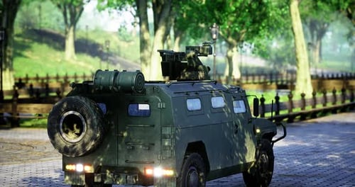 Military Vehicle Parked Along a Tree Lined Path in a Peaceful Park Setting