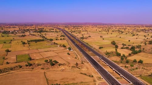 drone shot of highway roads with lands
