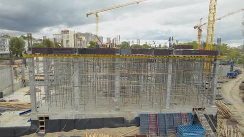 Laborers Install Scaffolding and Securing Steel Supports on Metro Station Construction Site