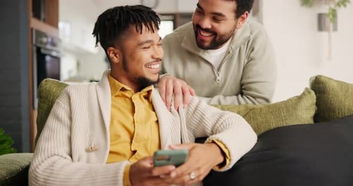 Gay couple, home and smartphone with happiness, smile and communication in lounge and connection