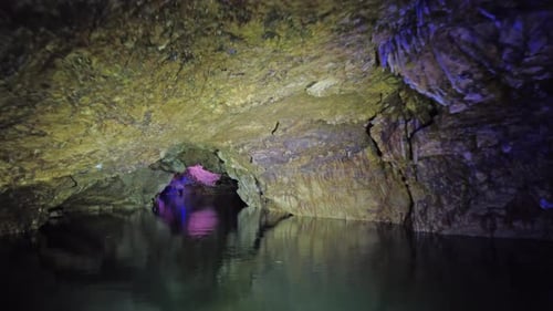 Boating on Underground River in Dark Cave