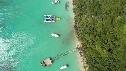 Aerial Drone Footage Showcasing Boats Floating in the Crystal Waters of the Caribbean