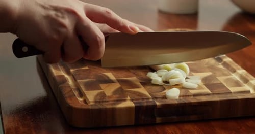 Fresh Green Onions Large Cut Into Rings on Wooden Cutting Board Over Wooden Table Closeup Chef