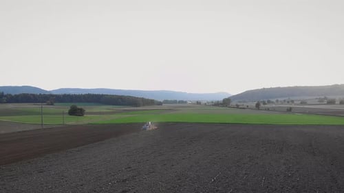 Tractor working on field