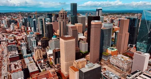 Flying closer to the beautiful modern high-rise buildings in the downtown of Seattle, Washington