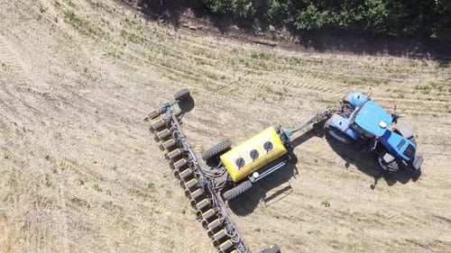 Blue Tractor O.A. Planting Canola On No Till Field