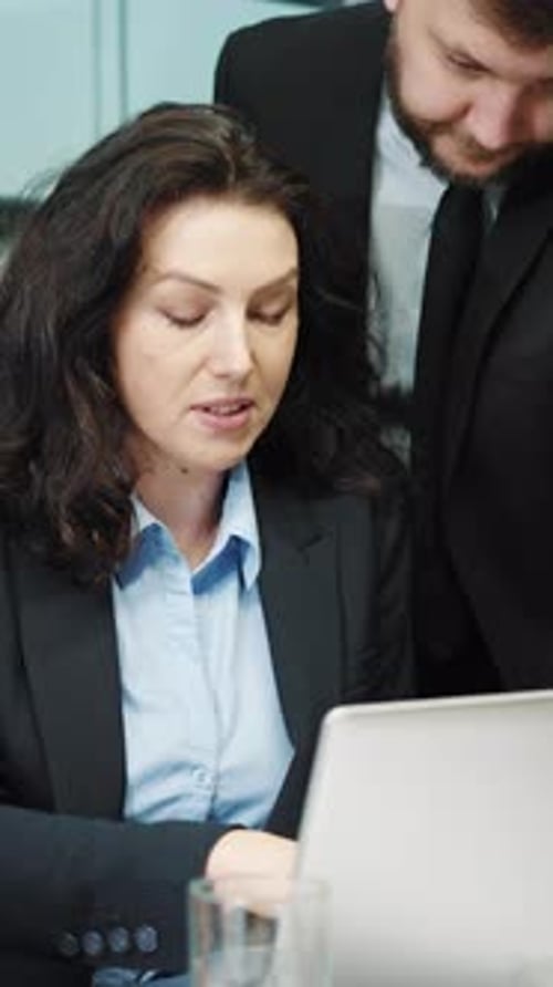 Team Discussing Data and Strategy in Workplace