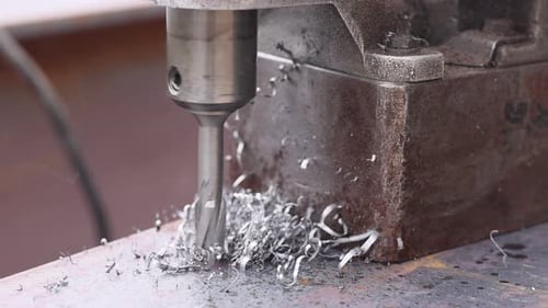 Metal Drilling Machine in Operation at Construction Site During Precision Workmanship