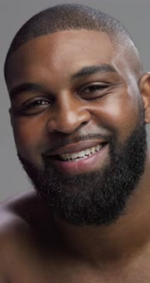 Studio, black man or face with glow for skincare, grooming or beauty with cosmetics for beard