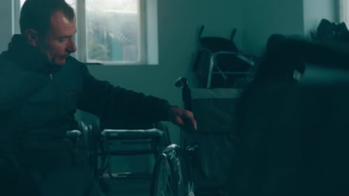 A Disabled Man Assembles a Stroller