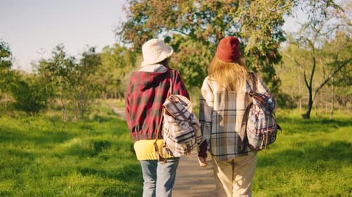 A Group of Adventurous Friends Joyfully Exploring the Beautiful Nature Together Equipped with