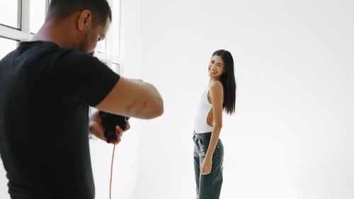 Photographer Taking Photos of Woman in Studio