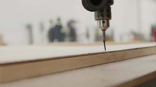 Close Up of Drilling Wood in a Workshop