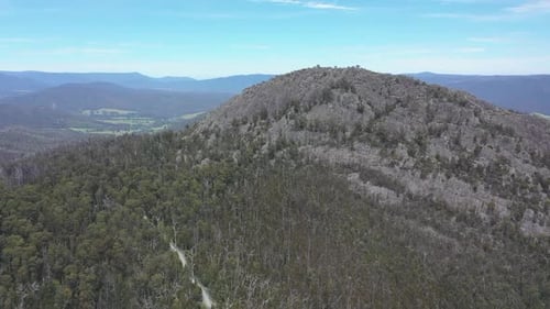 Aerial: Cerberus Rd is dirt road used to access Sugarloaf Peak, VIC