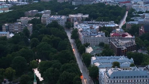 Aerial View of City Park and Historic Palaces Tilt Up Reveal Wide Watercourse and Cityscape at Dusk